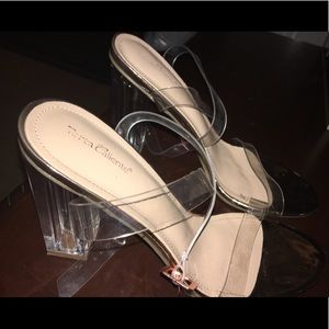 Gold ankle top heels with clear heel.